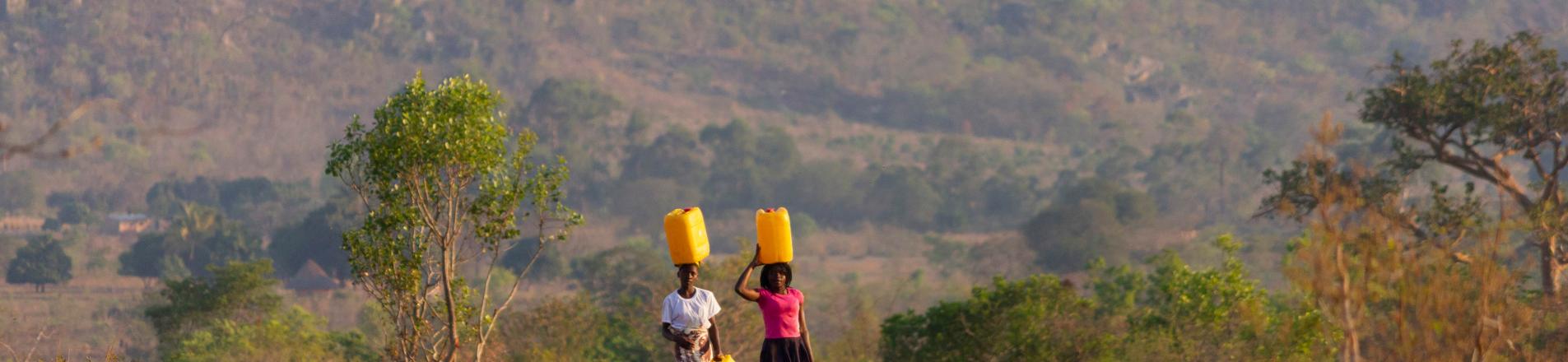 Girls carrying water