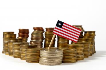 Coins with Liberian flag, symbolizing tax collection