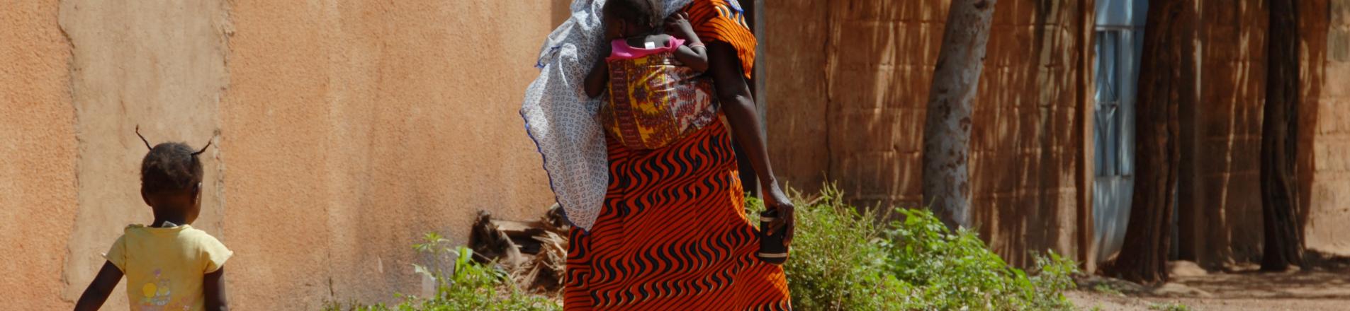 mother with two children in Burkina Faso