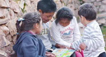 children looking at book