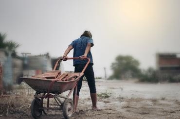 child at work, reflecting this articles theme of reducing child labour in Bolivia