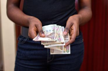 woman in kenya counting money